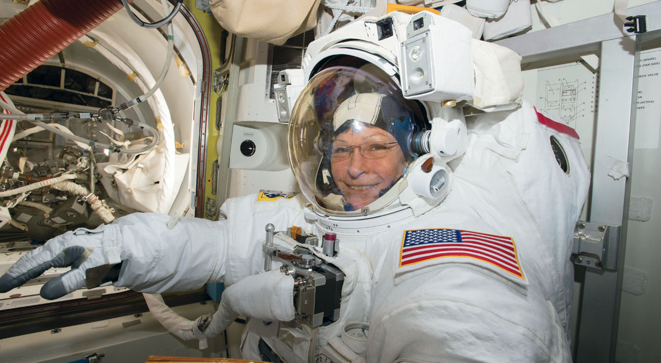 Astronaut Peggy Whitson prepares for a space walk from the International Space - photo 5