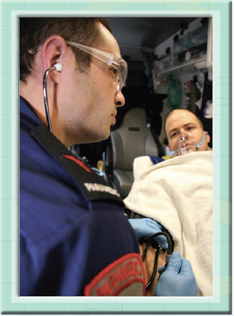 A paramedic treats a patient with oxygen to help him breathe more easily after - photo 2