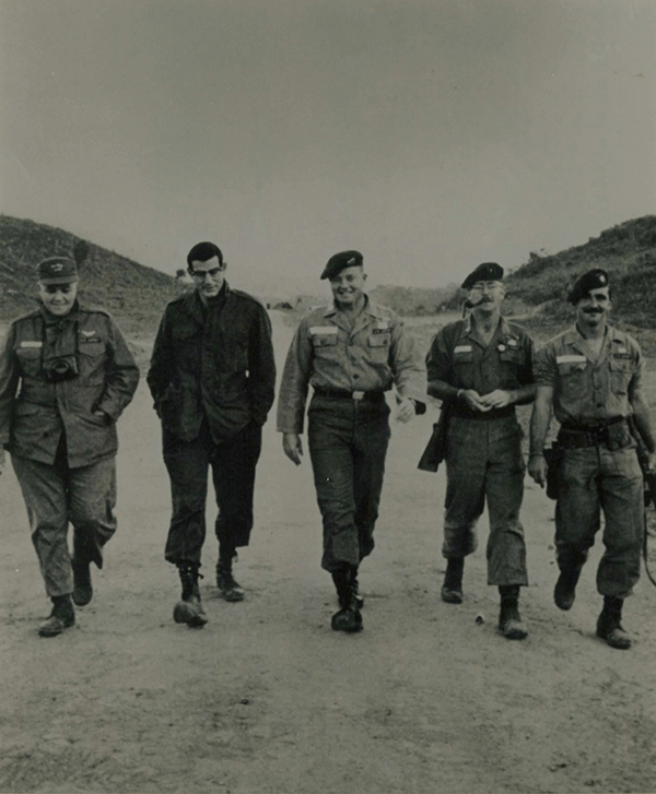 Halberstam shown second from left walking with military officers in Vietnam - photo 7