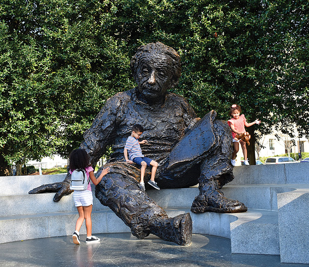 Children play at the Albert Einstein memorial sculpture in front of the - photo 8