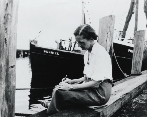 Carson writing on a dock She expressed her love for nature first as a writer - photo 7