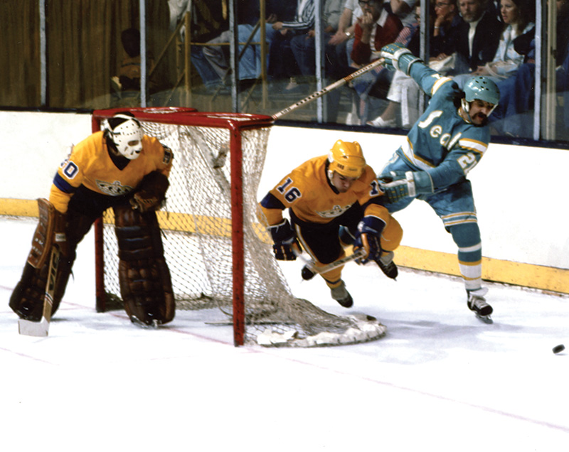 Fighting for the puck against future Hall of Famer Marcel Dionne Playing - photo 11