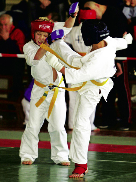 A kickboxer must protect the head and face during a kickboxing match - photo 5