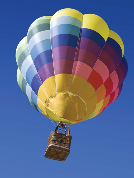 The envelope of a hot air balloon displays a variety of bright colors and - photo 11