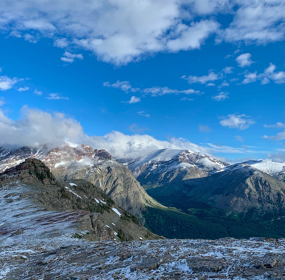 Parting clouds after an early morning snow shower on the Continental Divide - photo 6