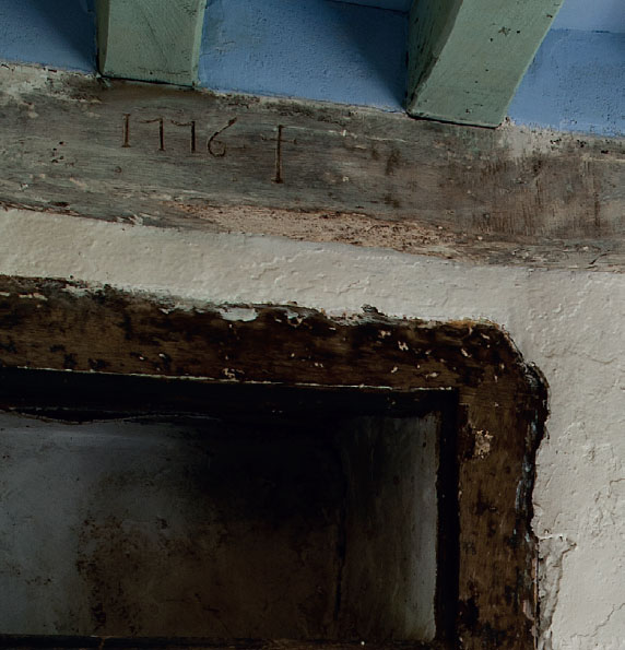 Carved into one of the ceiling beams in the kitchen is the date 1776 the year - photo 8