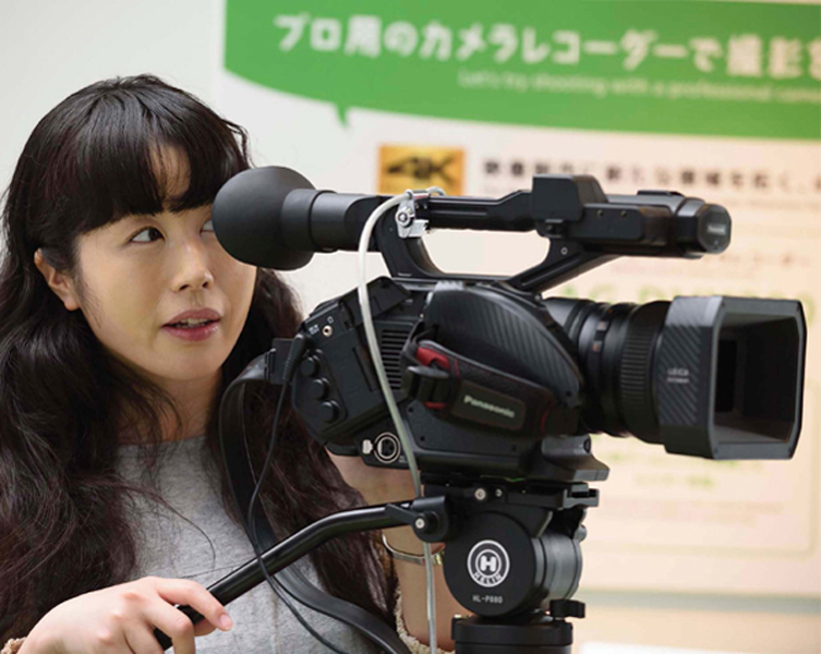 Here a visitor at the Panasonic Center showroom in Tokyo Japan tries a - photo 2