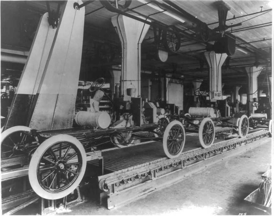 This image from around 1913 shows the automobile assembly line at the Ford - photo 7