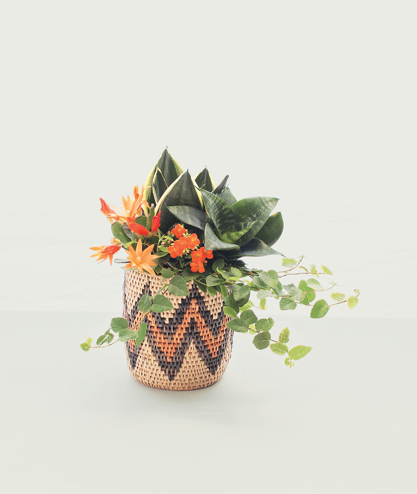 A basket is a fun alternative to a traditional vase Just make sure you protect - photo 8