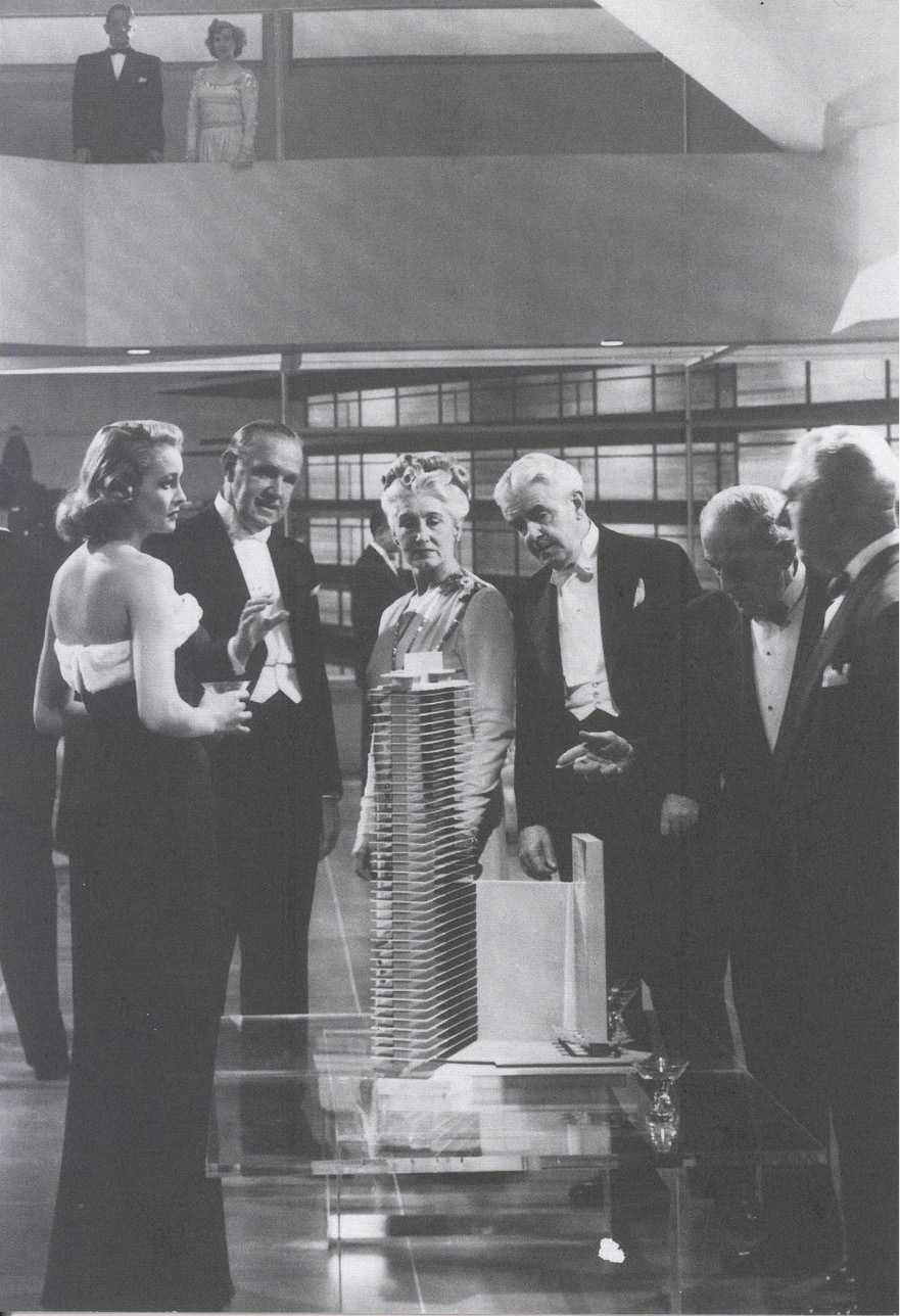 Partygoers inspect a model apartment tower in King Vidors The Fountainhead - photo 2