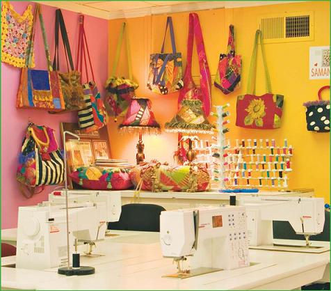 Colorful threads projects and fabrics fill the ample workspace at the B - photo 11