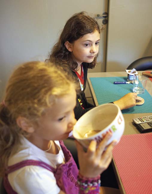 Corinne is drinking hot chocolate from her bowl When breakfast is - photo 3