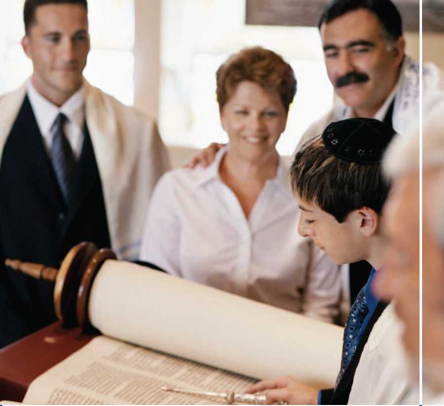 A boy reads from the Torah or Hebrew Scripture athis Bar Mitzvah In this - photo 4