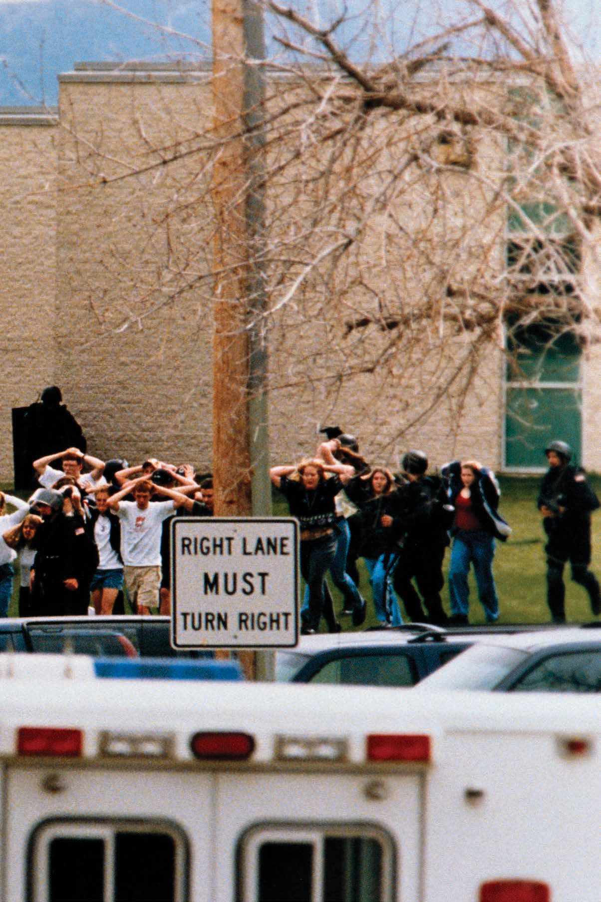 Students flee Columbine High School during a shooting that killed twelve - photo 2