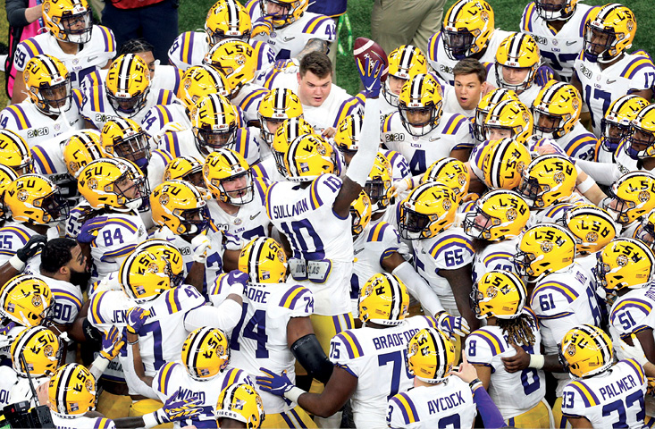 The LSU Tigers gather around senior Stephen Sullivan for the pre-game huddle in - photo 5