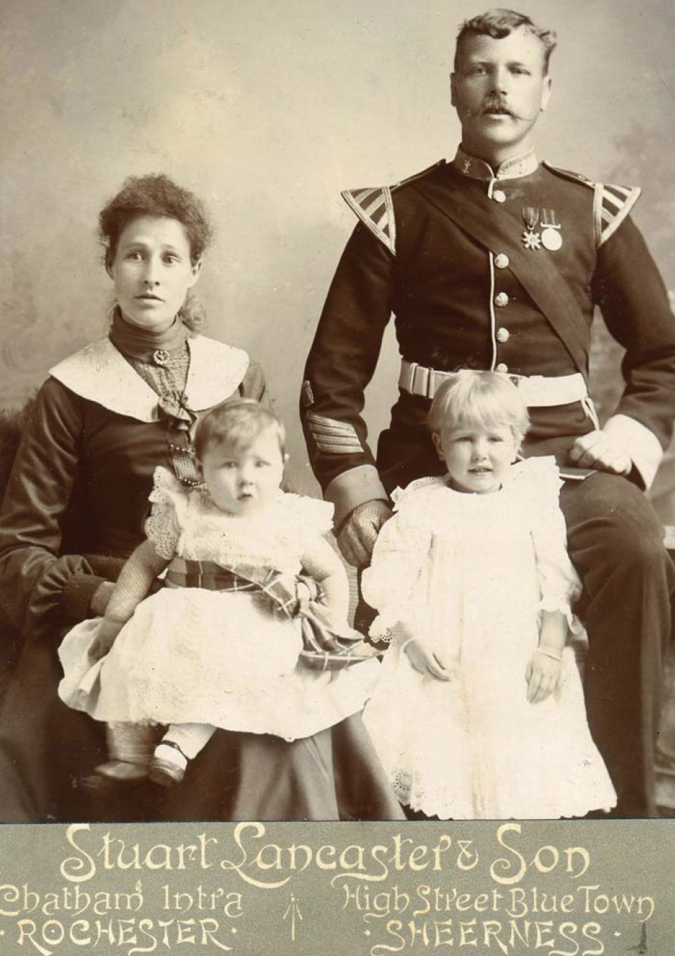 Two young army children photographed with their parents in Kent in the early - photo 5