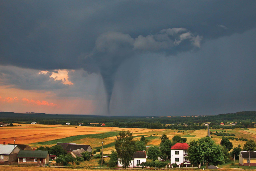 A tornado is a column of air that rotates powerfully and drops from a - photo 4