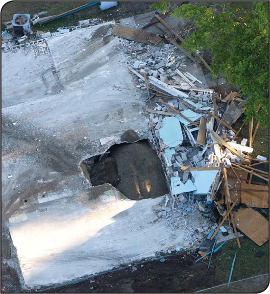 An overhead view of Jeff Bushs ruined home shows the sinkhole that opened up - photo 8