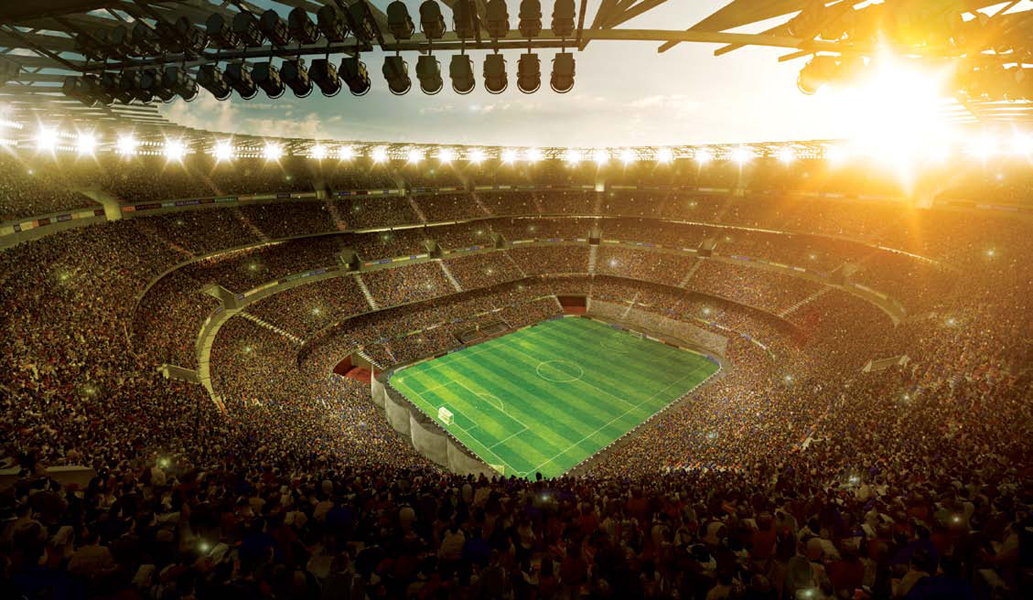 Thousands of fans crowd into an enormous stadium to watch a soccer match under - photo 4