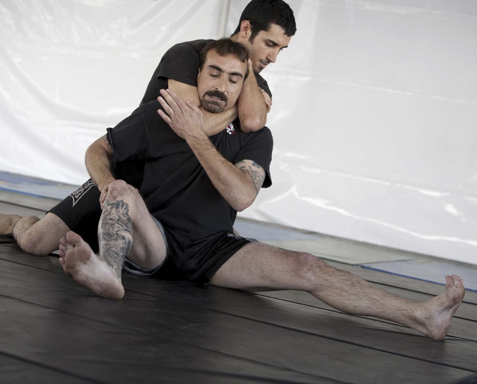 These two jujitsu instructors are demonstrating the proper way to apply the - photo 8