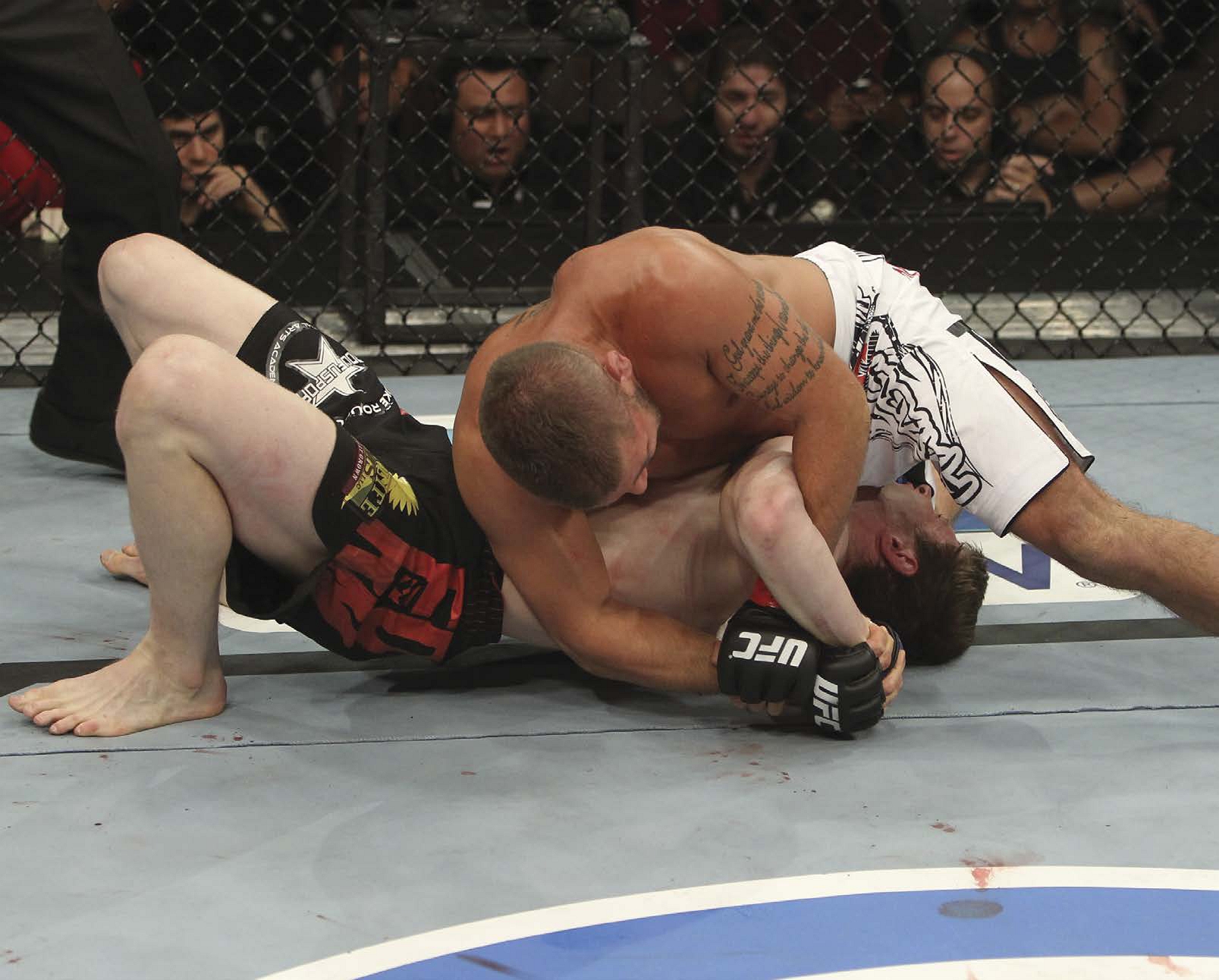 In this photograph from 2011 MMA fighter Jeremy Stephens white trunks - photo 5