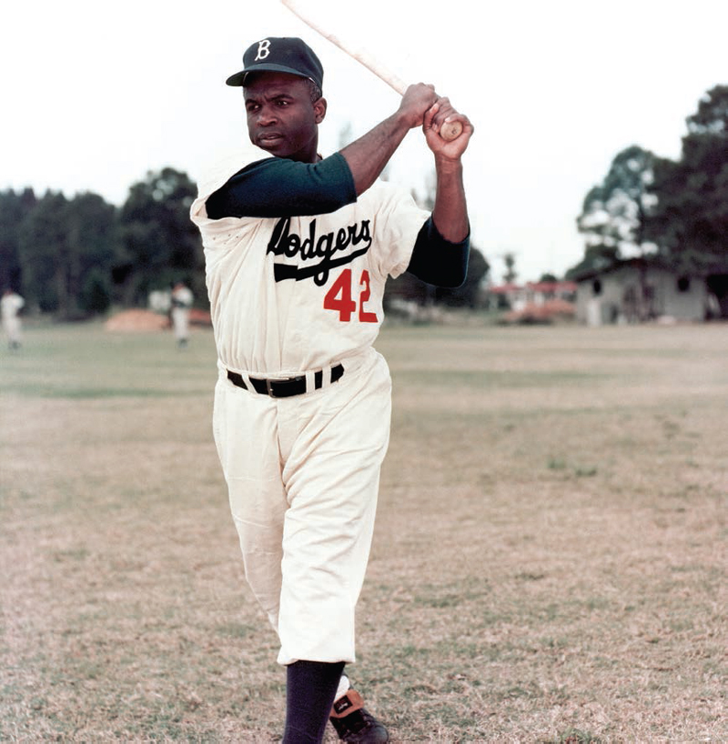 Jackie Robinson takes batting practice in his Brooklyn Dodgers uniform at the - photo 4