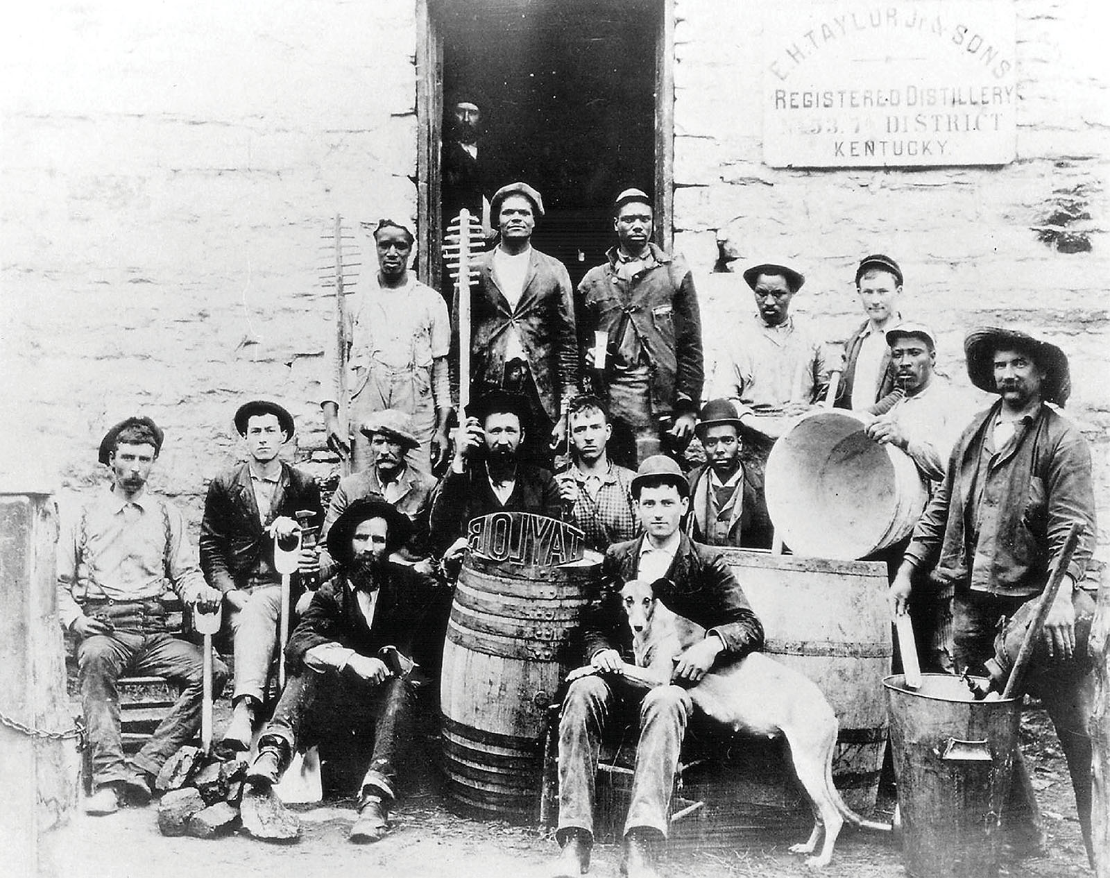 employees gather in front of what is now called the Old Taylor House located - photo 5