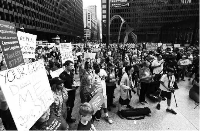 BILGIN SASMAZANADOLU AGENCYGETTY IMAGES People in Chicago gather to - photo 3