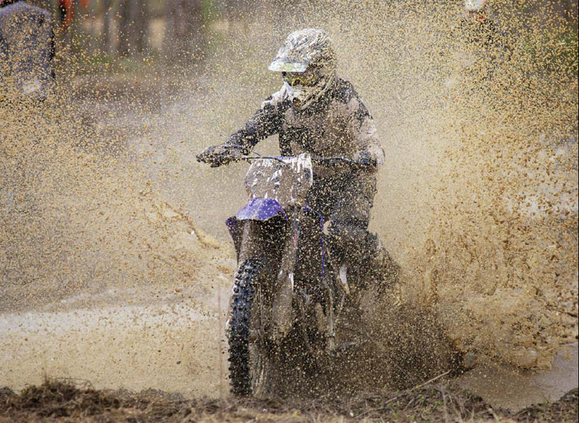 Motocross riders never let a little mud puddleor a big oneget in their way - photo 4