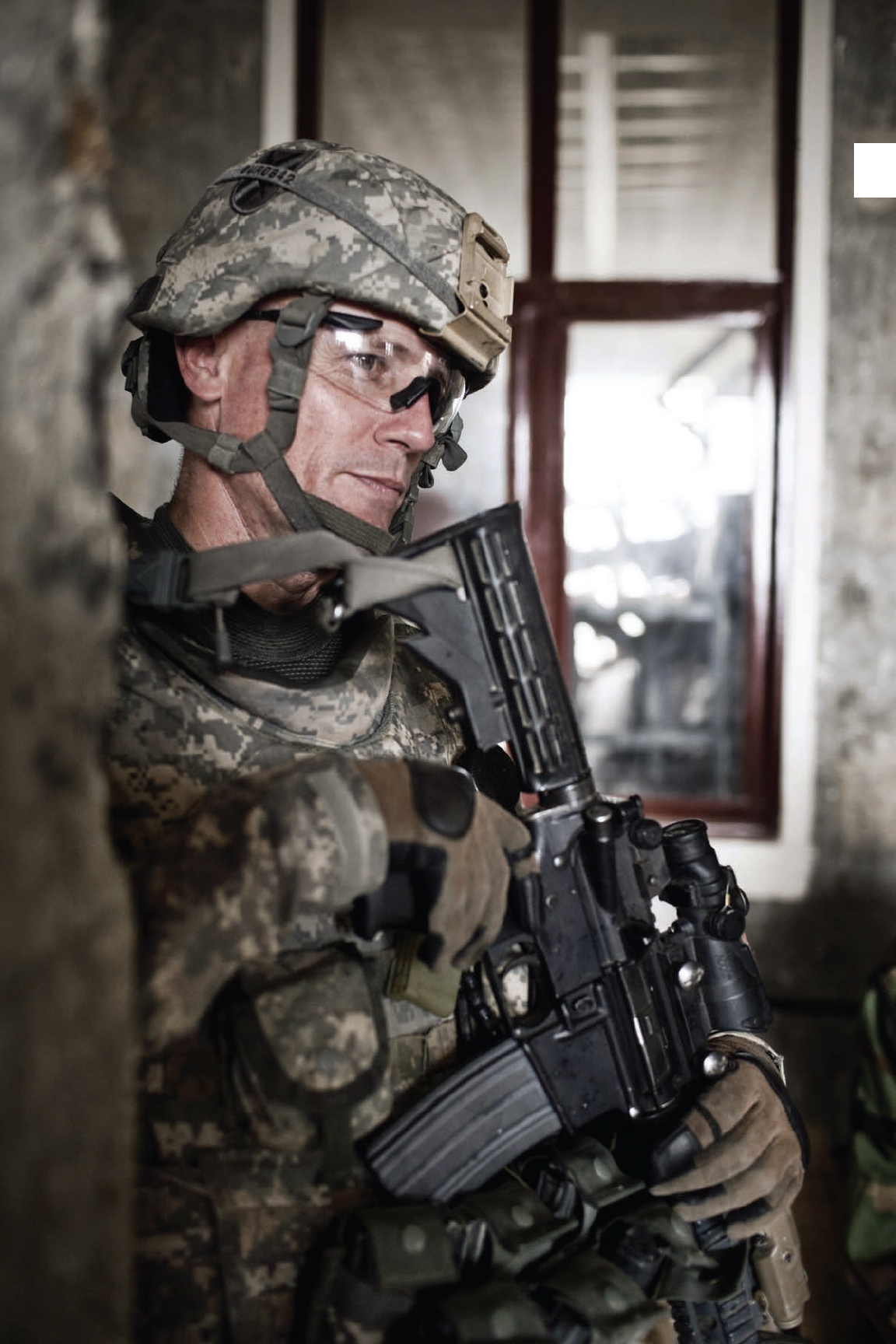 An American soldier secures a building in Afghanistan before the countrys 2009 - photo 2