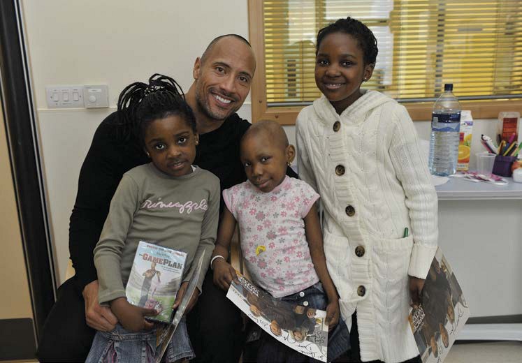 Dwayne started a charity to help sick children Here he visits with young - photo 11