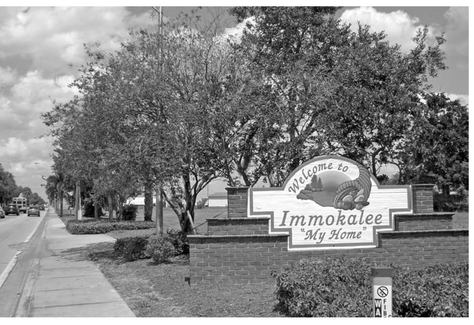Sign welcoming visitors to Immokalee Florida INTRODUCTION Invisible In the - photo 3