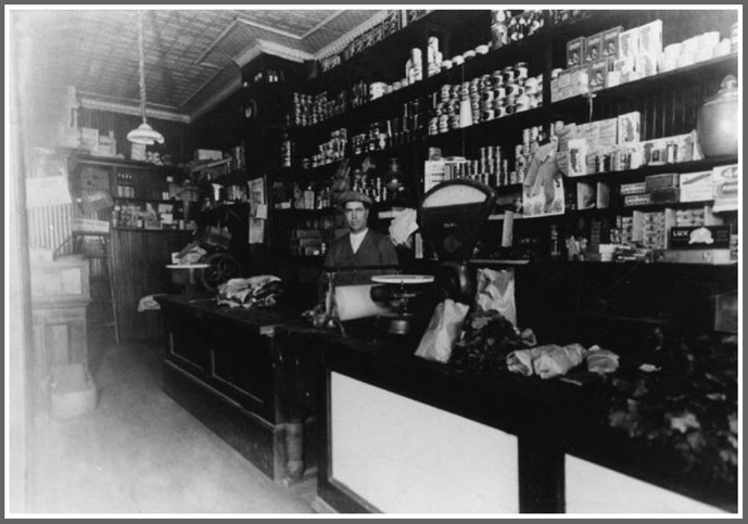 Orazio Santopietro behind the counter of his grocery store Division Street - photo 1