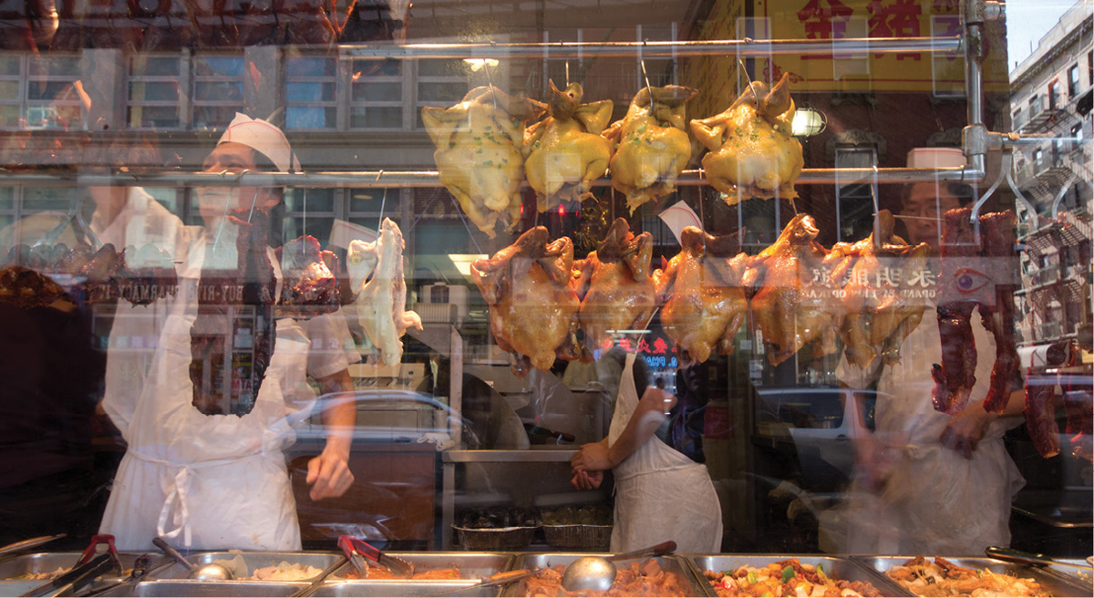 Gruesome-looking but delicious smoked ducks hang in the windows of a number of - photo 17