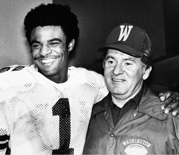 Warren Moon puts his arm around coach Don James after the 1978 Rose Bowl one - photo 3