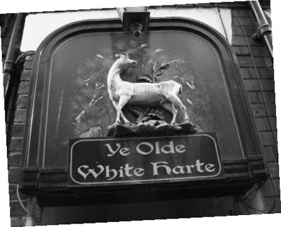 The sign above the doorway leading to Ye Olde White Harte Patricks second - photo 2