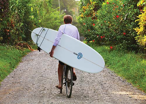 surfer riding bicycle in Cahuita youth with fresh fish Cahuita Costa - photo 3