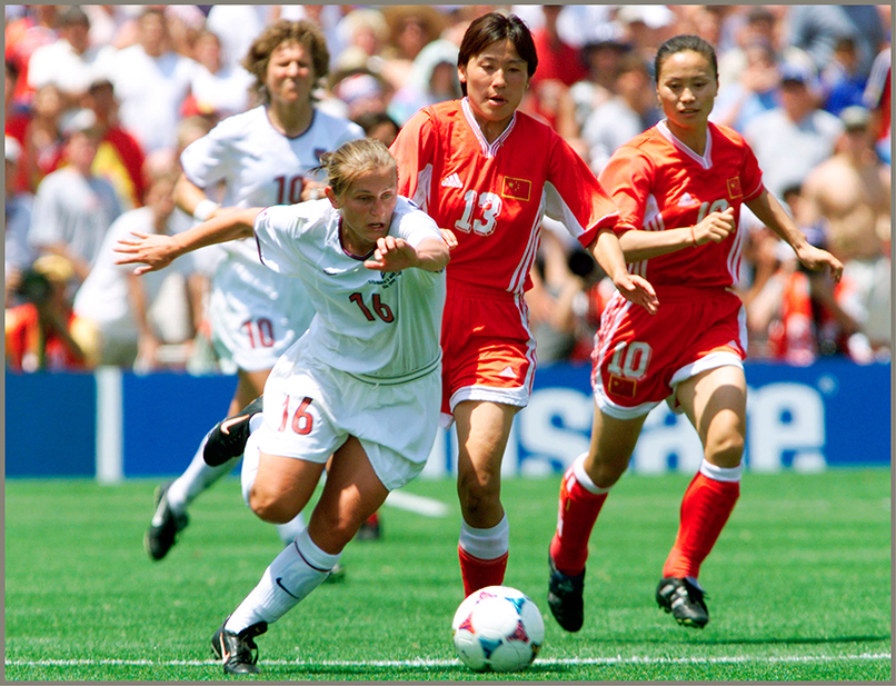 US forward Tiffeny Milbrett 16 was chased down the field during the second - photo 3