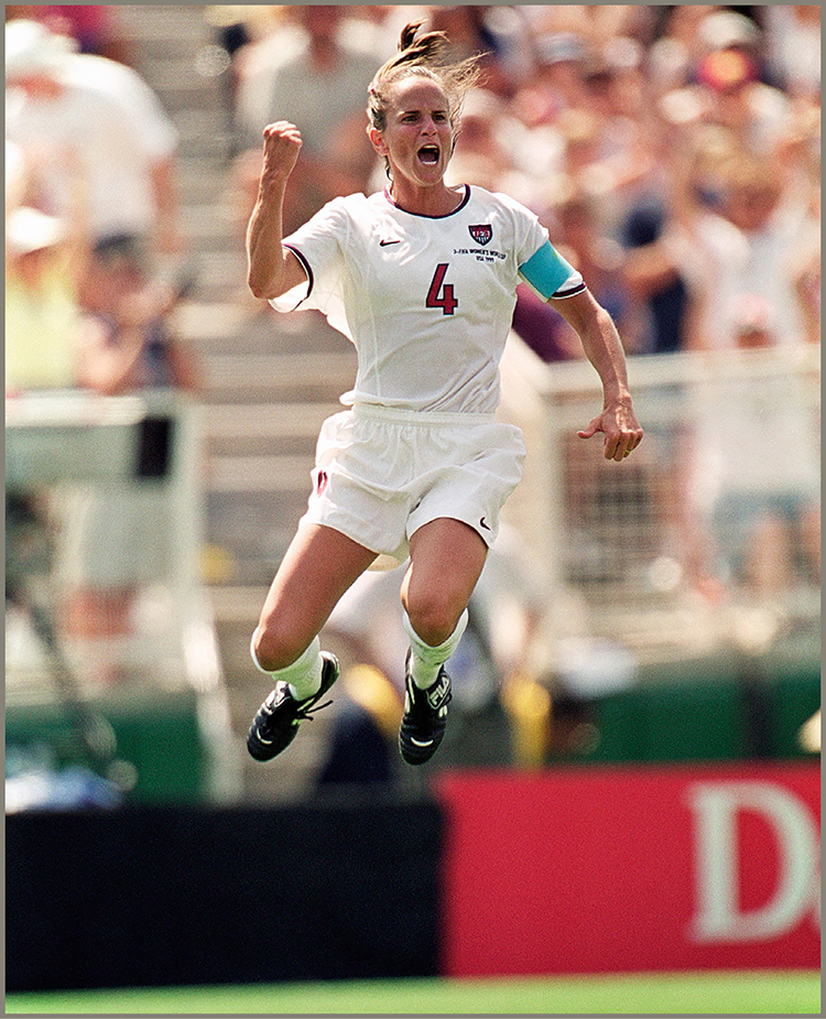 Defender Carla Overbeck leaped high in the air after her successful penalty - photo 6