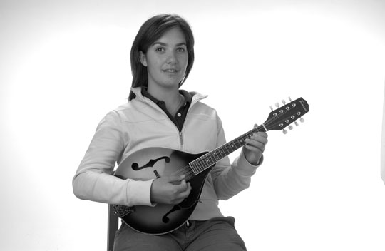 Sit up straight and hold the mandolin as shown in the photo The mandolin - photo 11