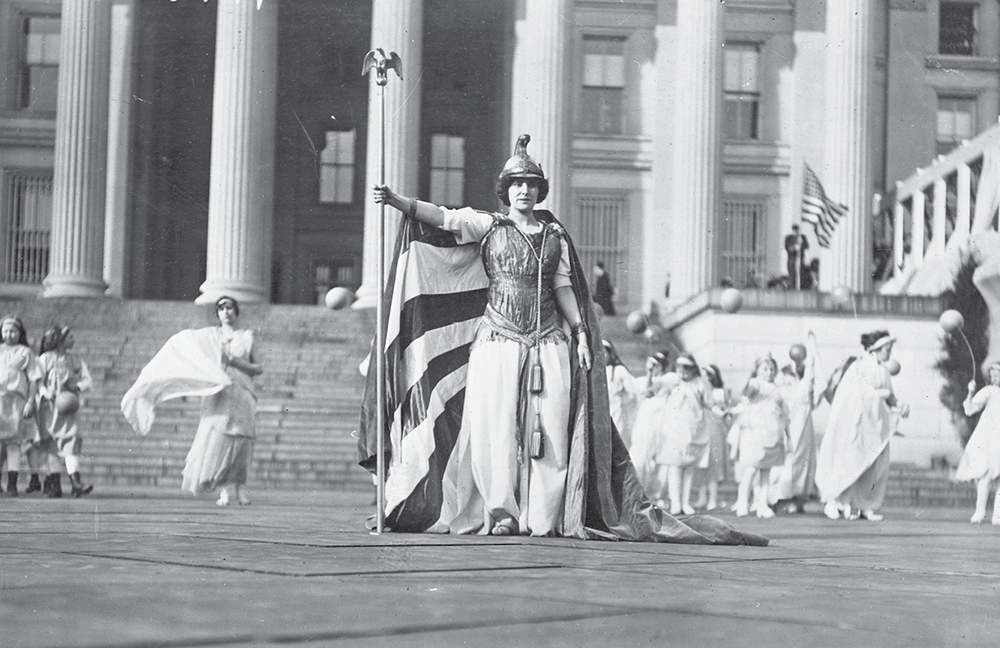 Costumed dancers including a performer dressed as Columbia a symbol of the - photo 3