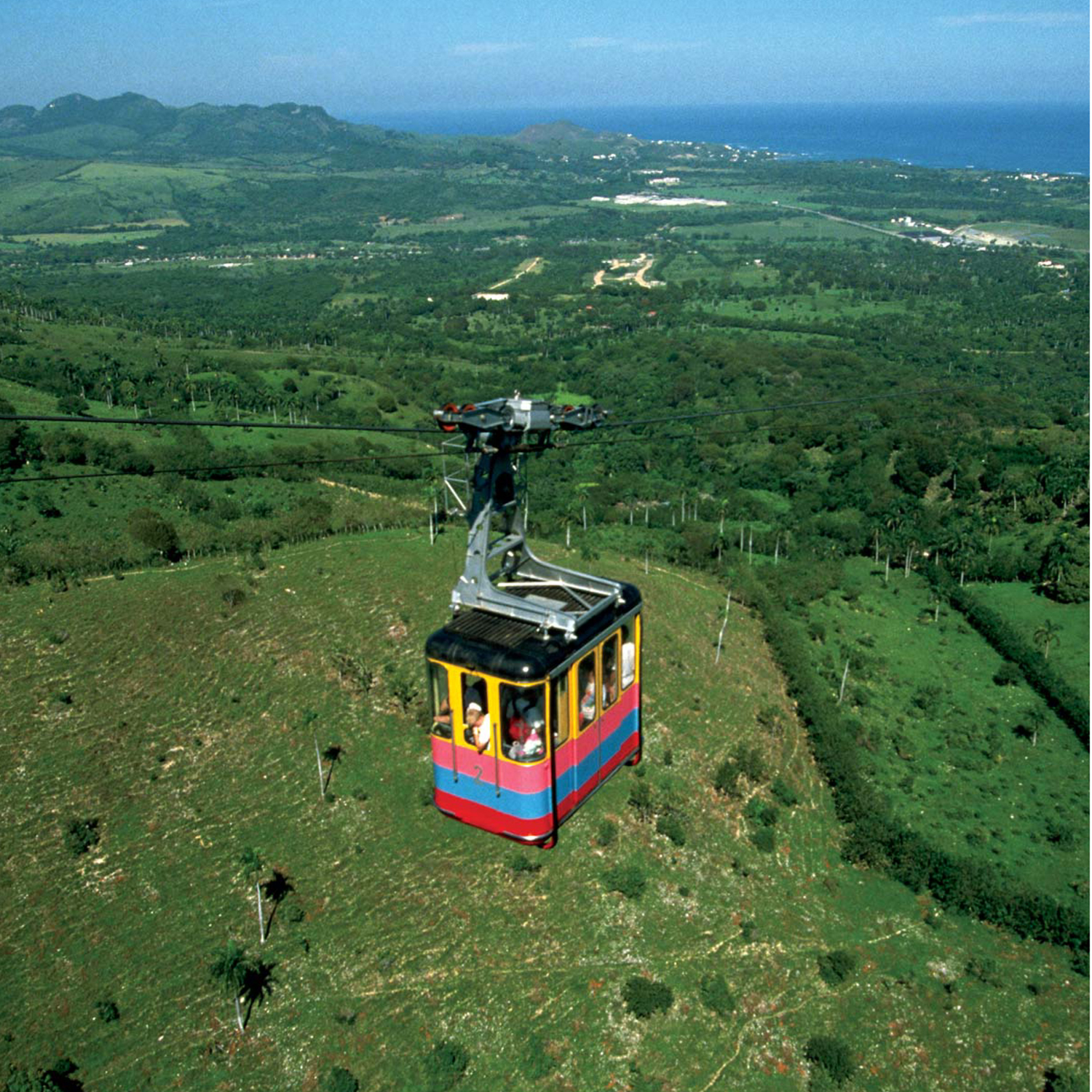 Passengers aboard this cable car headed up Mount Isabel de Torres have a - photo 11