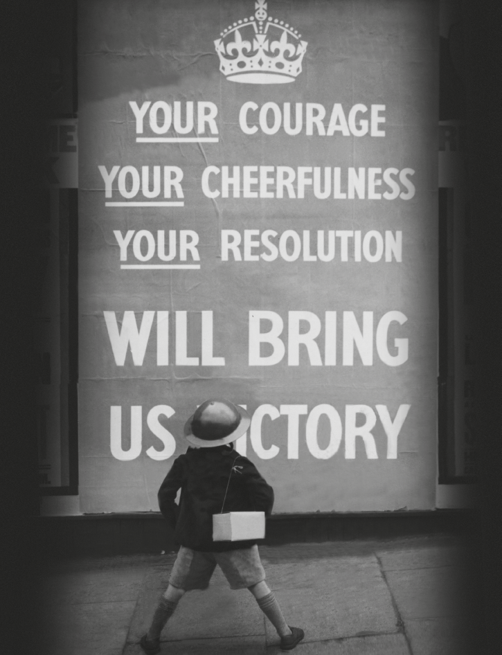 A boy looks at a propaganda poster in London 1939 I often wonder why the - photo 4