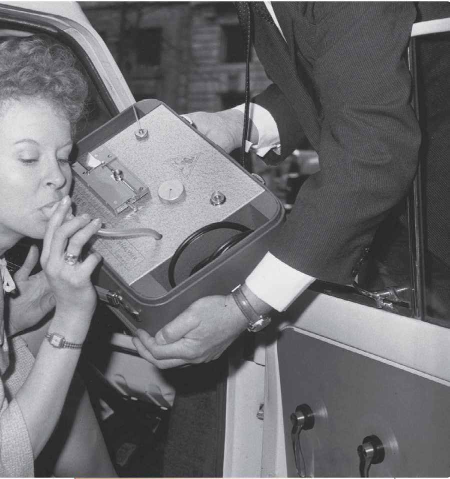 In this 1964 photograph a woman tries out the Drink-Meter an early version of - photo 5