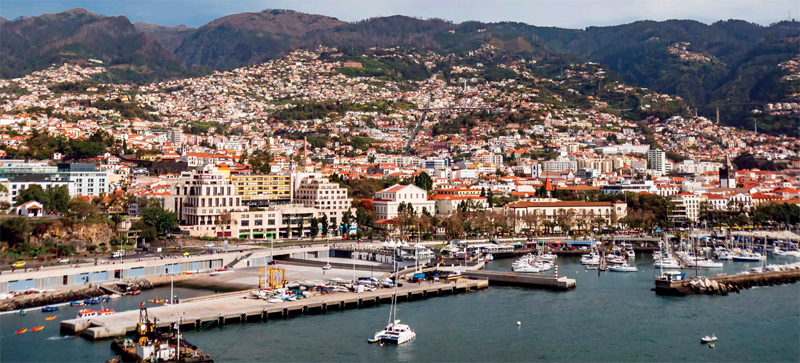 A view from above of the beautiful port city of Funchal on Madeira where - photo 5