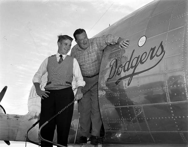 Peter OMalley left and father Walter admire the Dodgers team-owned DC-3 - photo 2