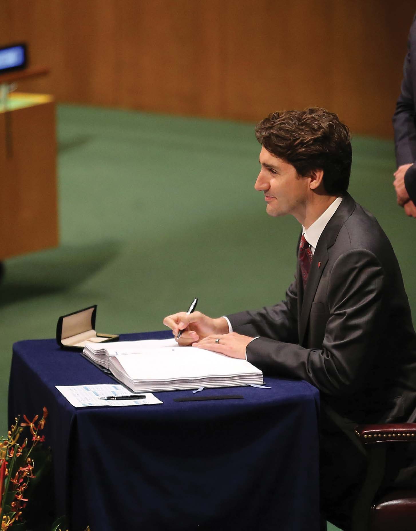 Canadian prime minister Justin Trudeau signs the Paris Agreement on April 22 - photo 15