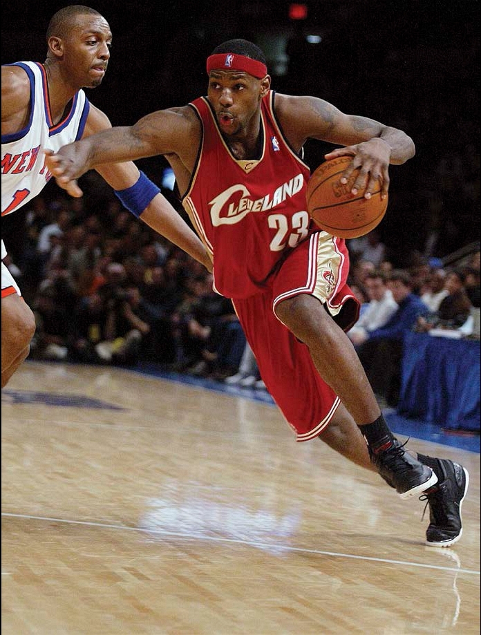 LeBron drives the ball past an opponent during his rookie year with the - photo 8