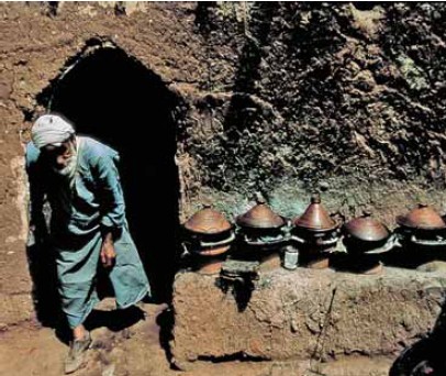 This shop in the At Ourir souk market east of Marrakech offers tagines cooked - photo 2