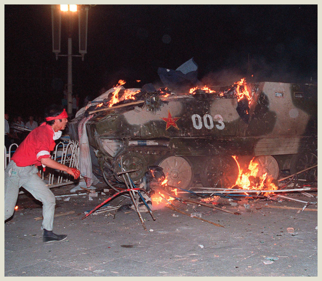 Students set an armored personnel carrier on fire during the height of the - photo 6